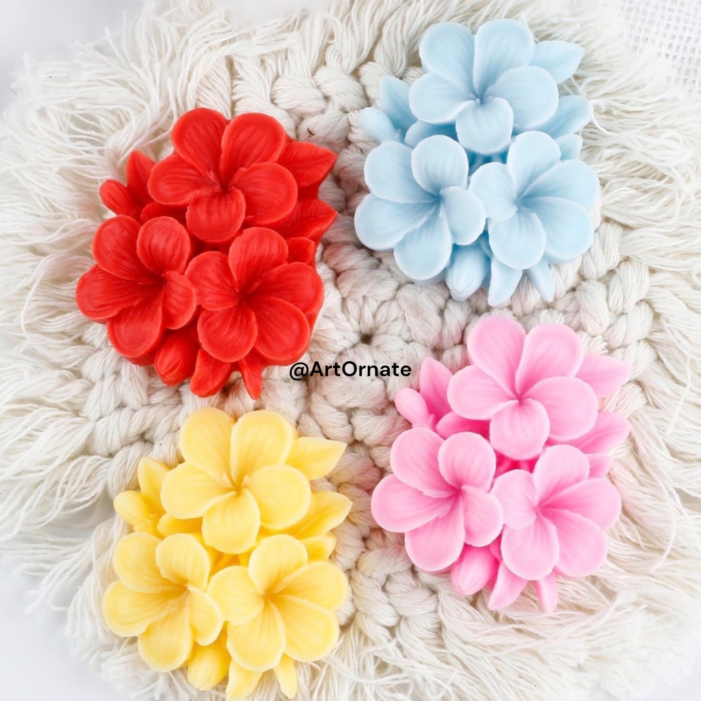 Top view of a durable floral silicone mould in a Plumeria shape suitable for hand-poured candle supplies