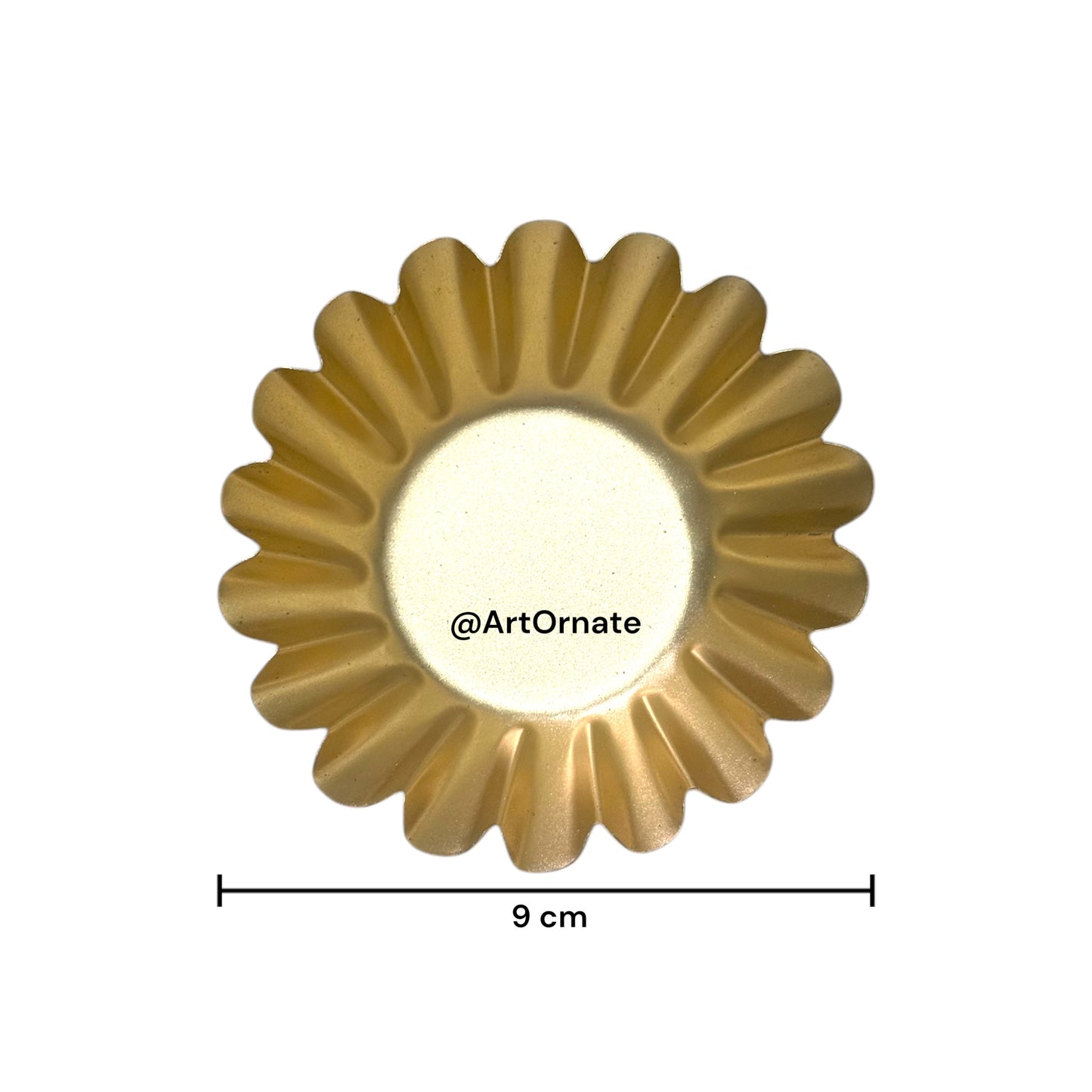 Decorative metal urli bowl filled with white candle, perfect for Indian weddings and spiritual festivals