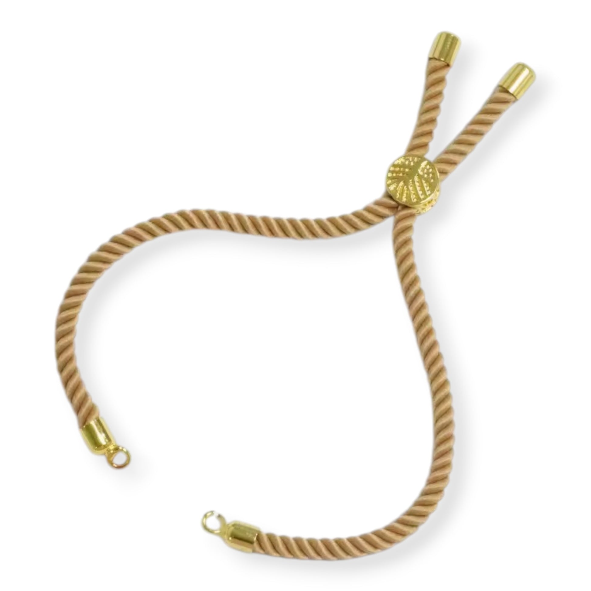 Slim-profile minimalist Rakhi thread in a rose-gold and cream color palette.